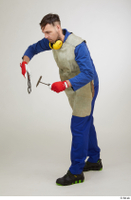  Photos Raul Conley standing whole body working with hammer and pliers 0002.jpg